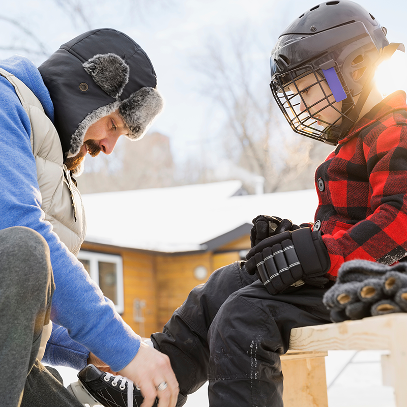 Father Tying Ice Skates For Son 2026 01 11 08 43 45 Utc